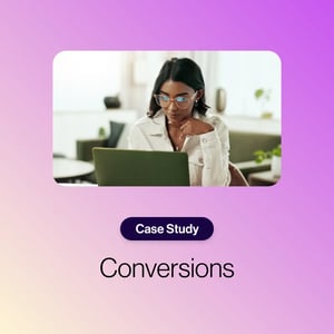 Conversions case study with woman sitting at a desk looking down at a laptop